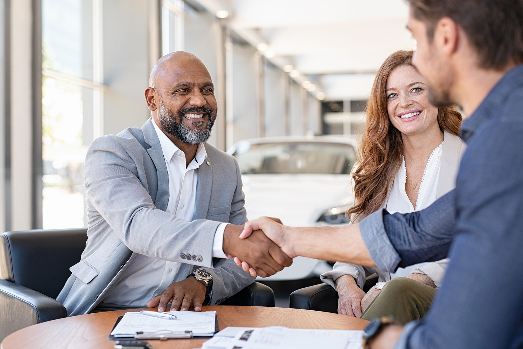 Car salesman shaking hands | Featured Image for Sell My Car Queensland.