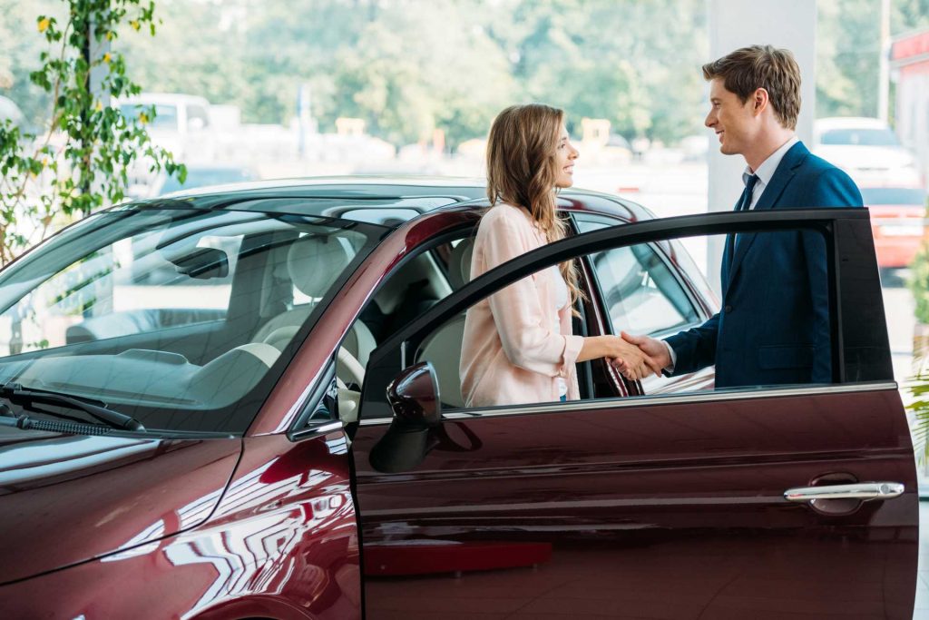 Car salesman shaking hands with a customer | Featured Image for Tips on Selling a Car Blog for Sell My Car Queensland.